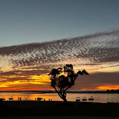 a sunset over a body of water