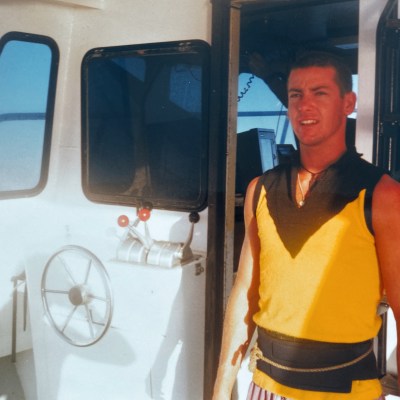 a person standing in front of a bus