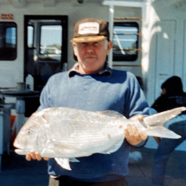 a man standing in a parking lot