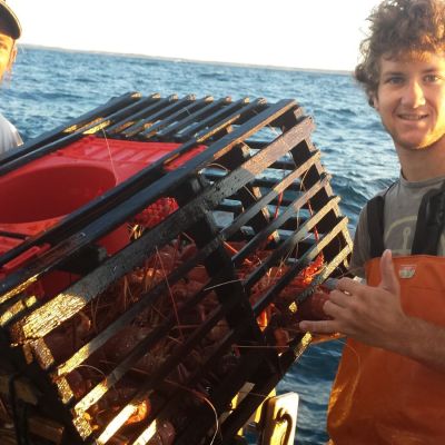 a person sitting on a boat in the water