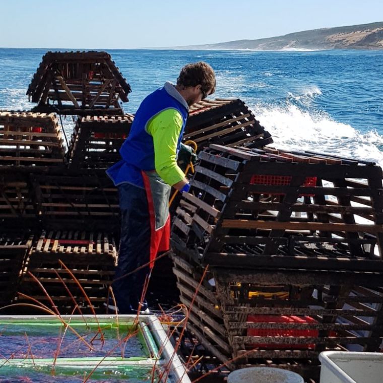 a person standing in front of a boat