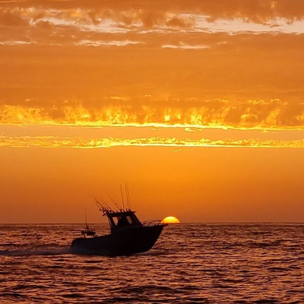 a sunset over a body of water